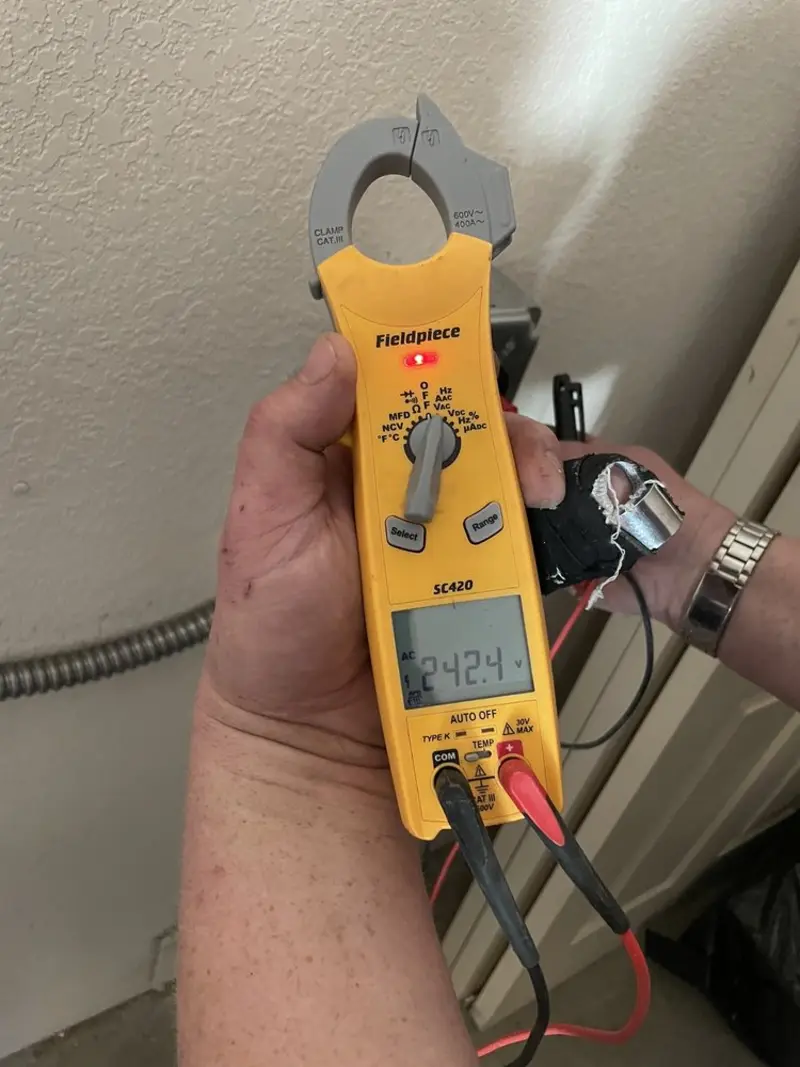 Voltage testing with clamp meter during Ceiling Fan Installation in Lake Norman of Catawba